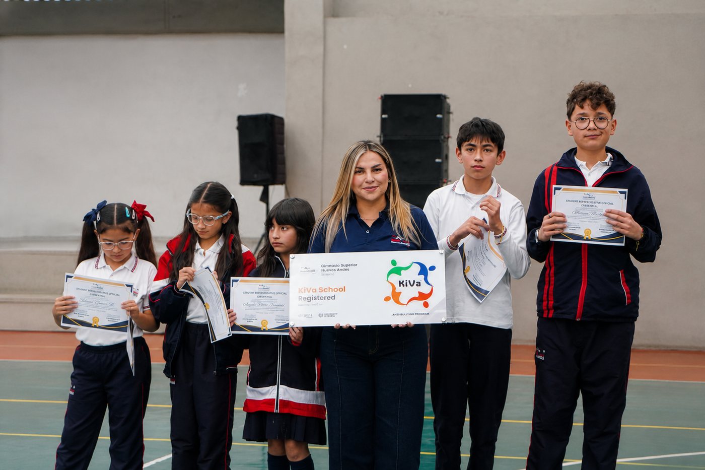 The school leadership with students from the KiVa programme